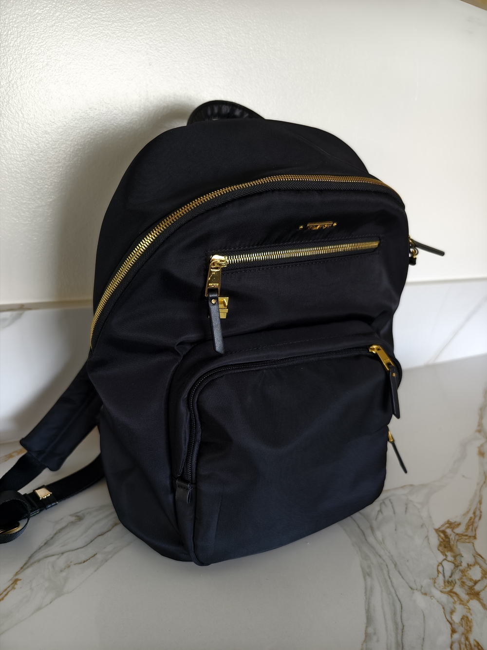 Tumi Black Backpack with Gold Zippers